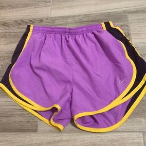 Purple and yellow Nike shorts
